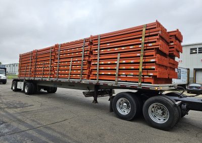 Bob G from A&A Surplus inspecting used pallet rack and cantilever rack in Plantsville warehouse shelving facility.